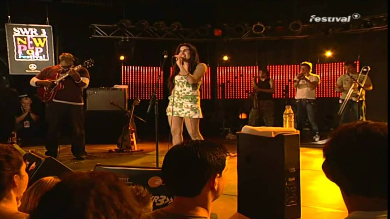 Amy Winehouse - Live At New Pop Festival backdrop