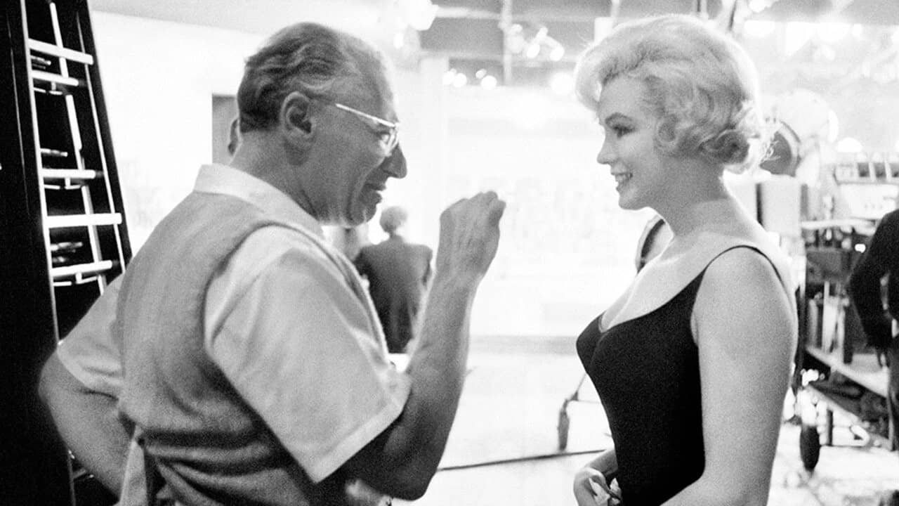 On Cukor backdrop