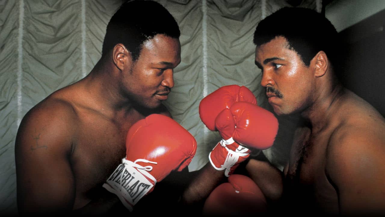 Muhammad and Larry backdrop