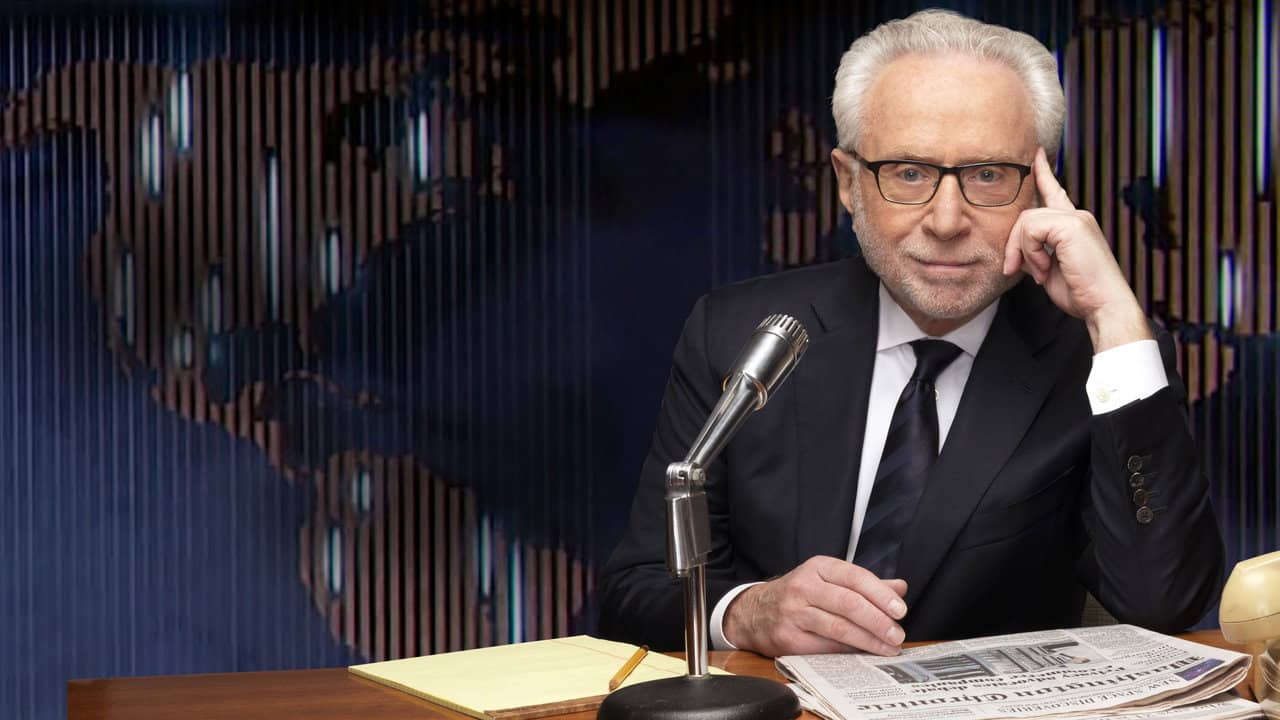 The Newscast with Wolf Blitzer backdrop